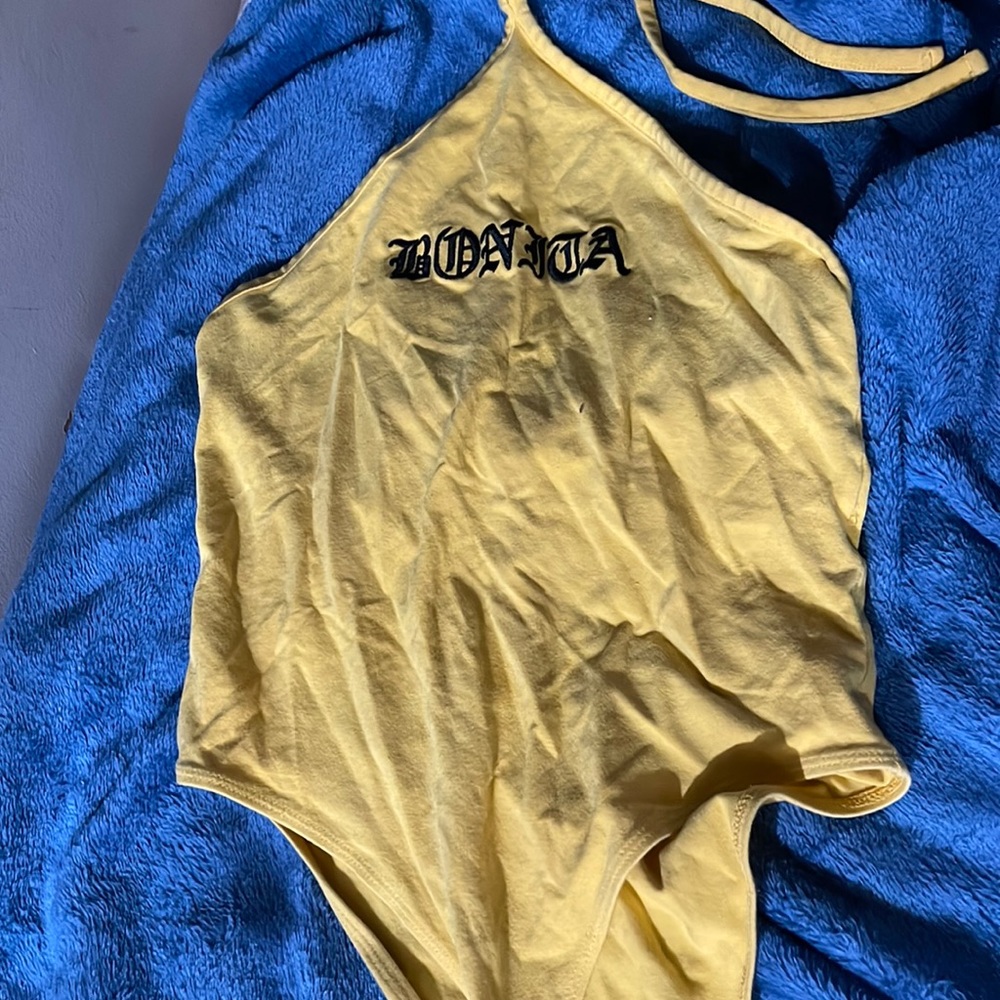 Yellow leotard with button closure